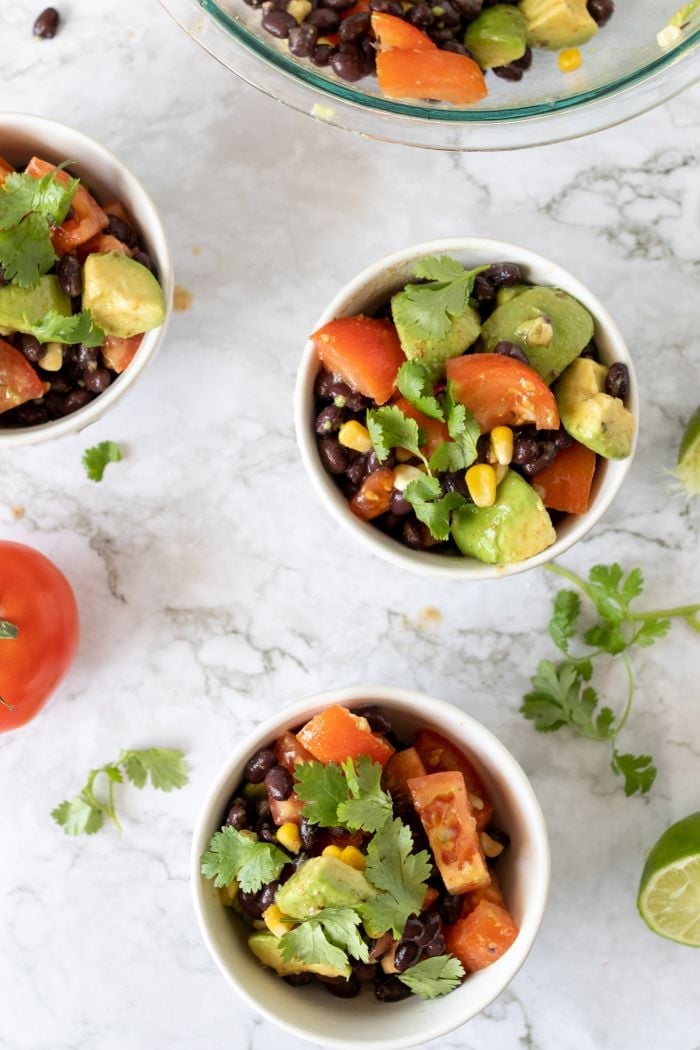 three bowls of Mexican Avocado Salad are shown